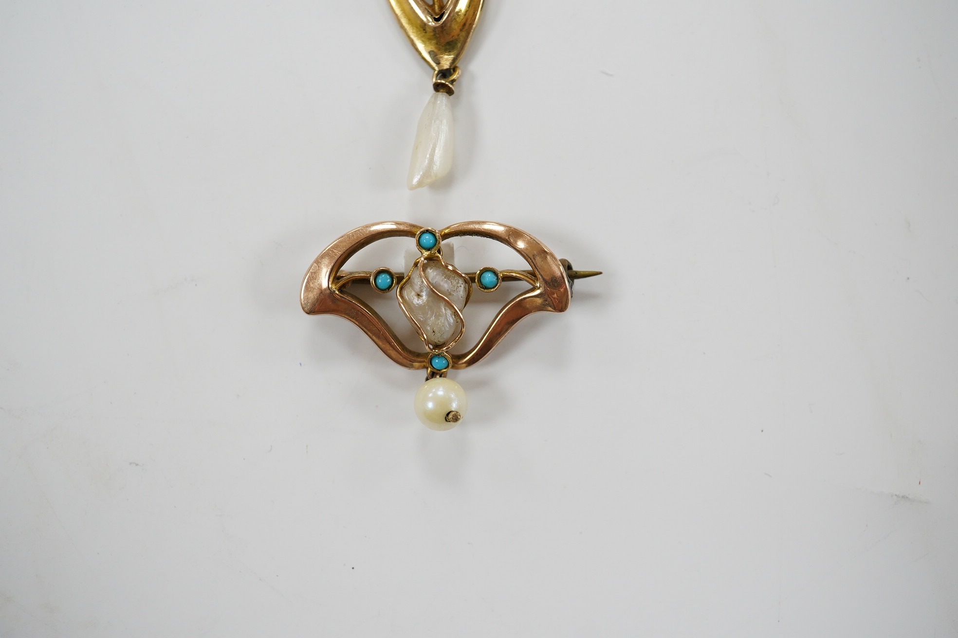 An Edwardian Art Nouveau 9ct gold, cabochon moonstone and baroque pearl drop set pendant, 56mm, together with a similar 9ct gold, baroque pearl and turquoise set drop brooch, 26mm, gross weight 4.5 grams. Condition - fai